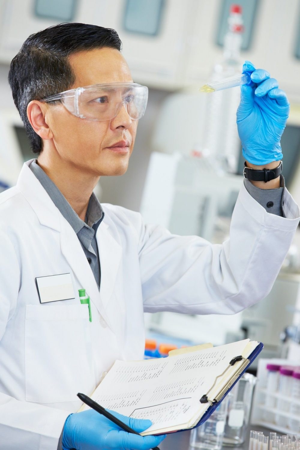 Scientist examining sample in laboratory